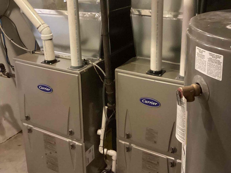 A furnace installed in a house by Hydro-Flo Plumbing & Heating in Edmonton, AB
