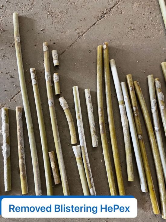 HePex Tubing Pieces Removed, Laid Out on a Concrete Surface, Showing Visible Blistering
